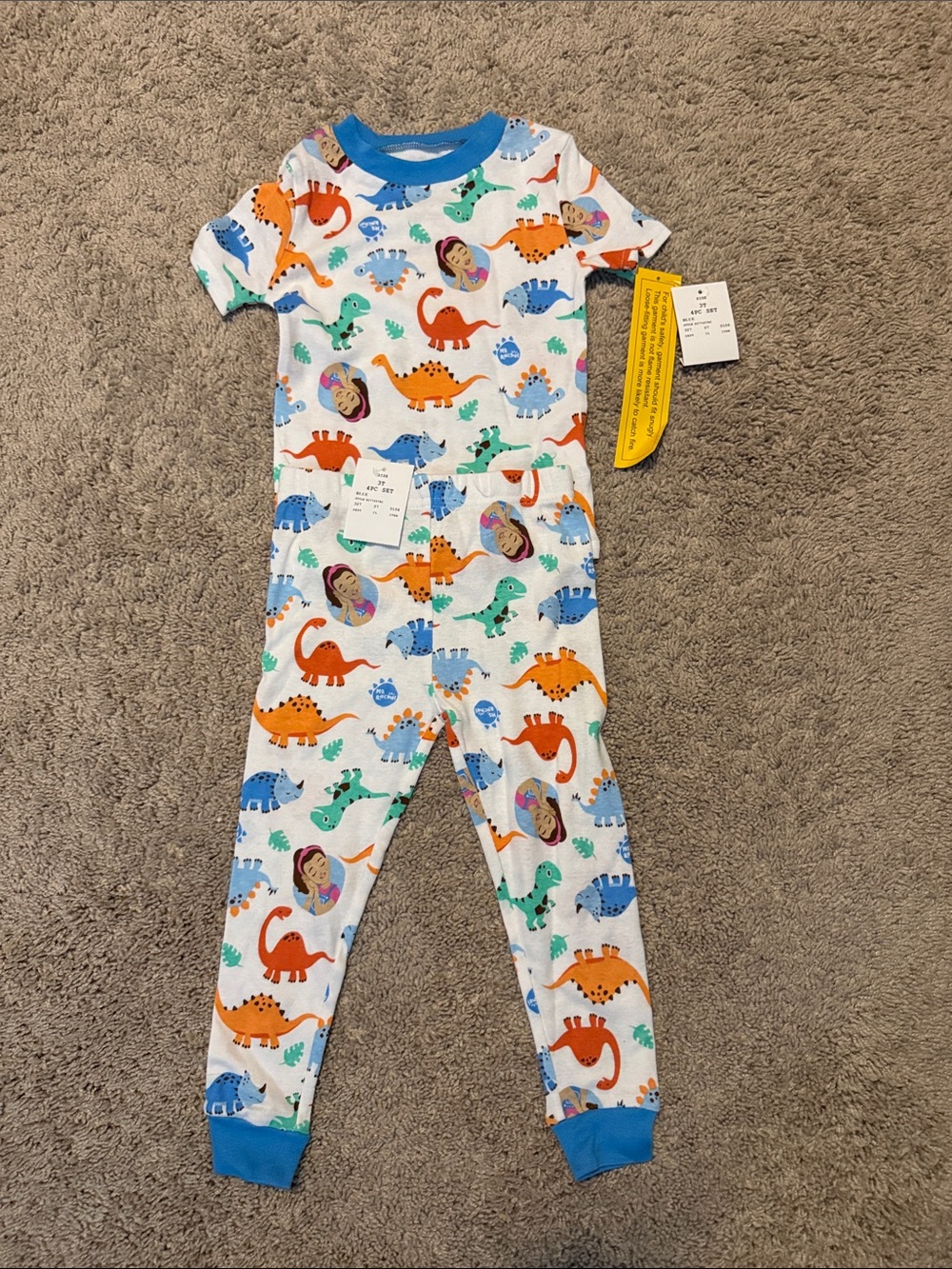 Ms Rachel Kids White Pajama Set with Blue, Orange, Green, and Purple Dinosaurs